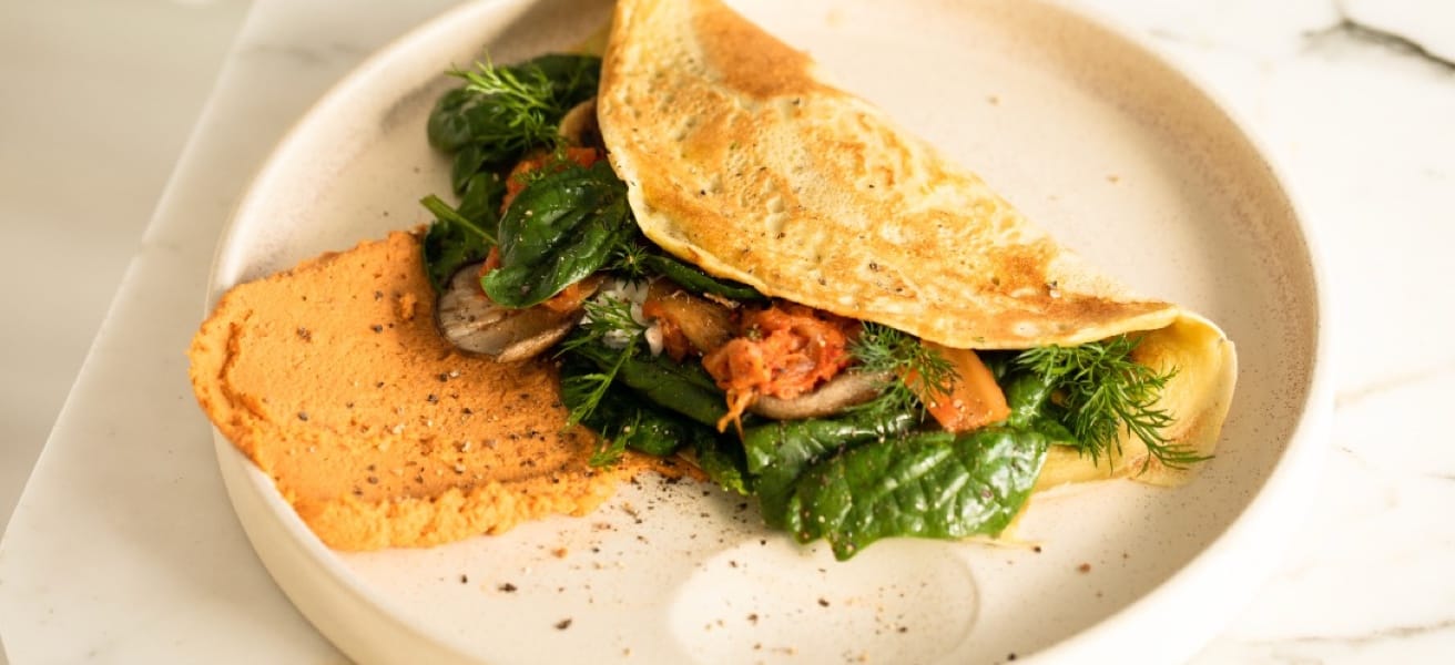 A photo of a cooked omelette on a plate